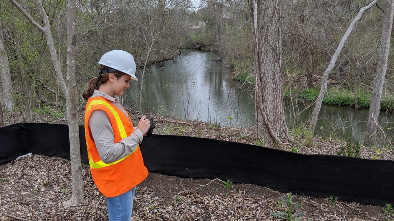 Expert updating BMP maps to facilitate construction team, working according to the laws.