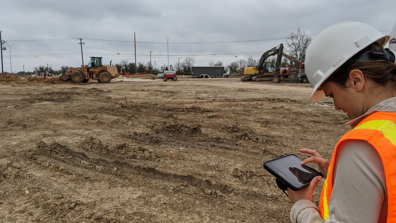 An expert inspector doing a site visit to develop the right erosion and sediment control plan.